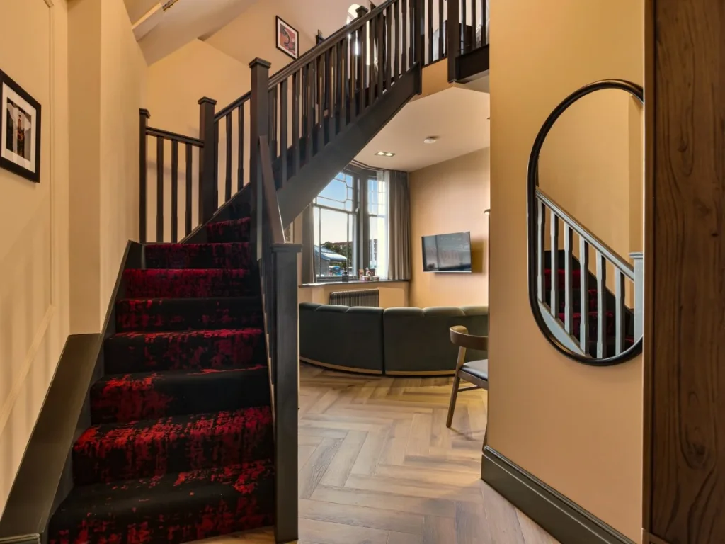 Staircase leading to the mezzanine bedroom above the living area