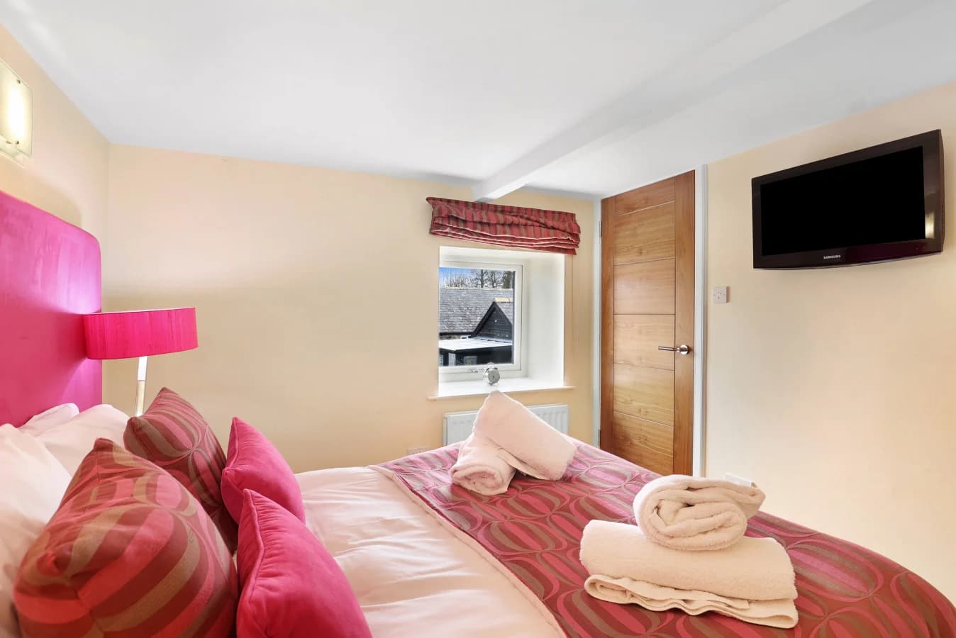 Double bedroom with wall-mounted TV