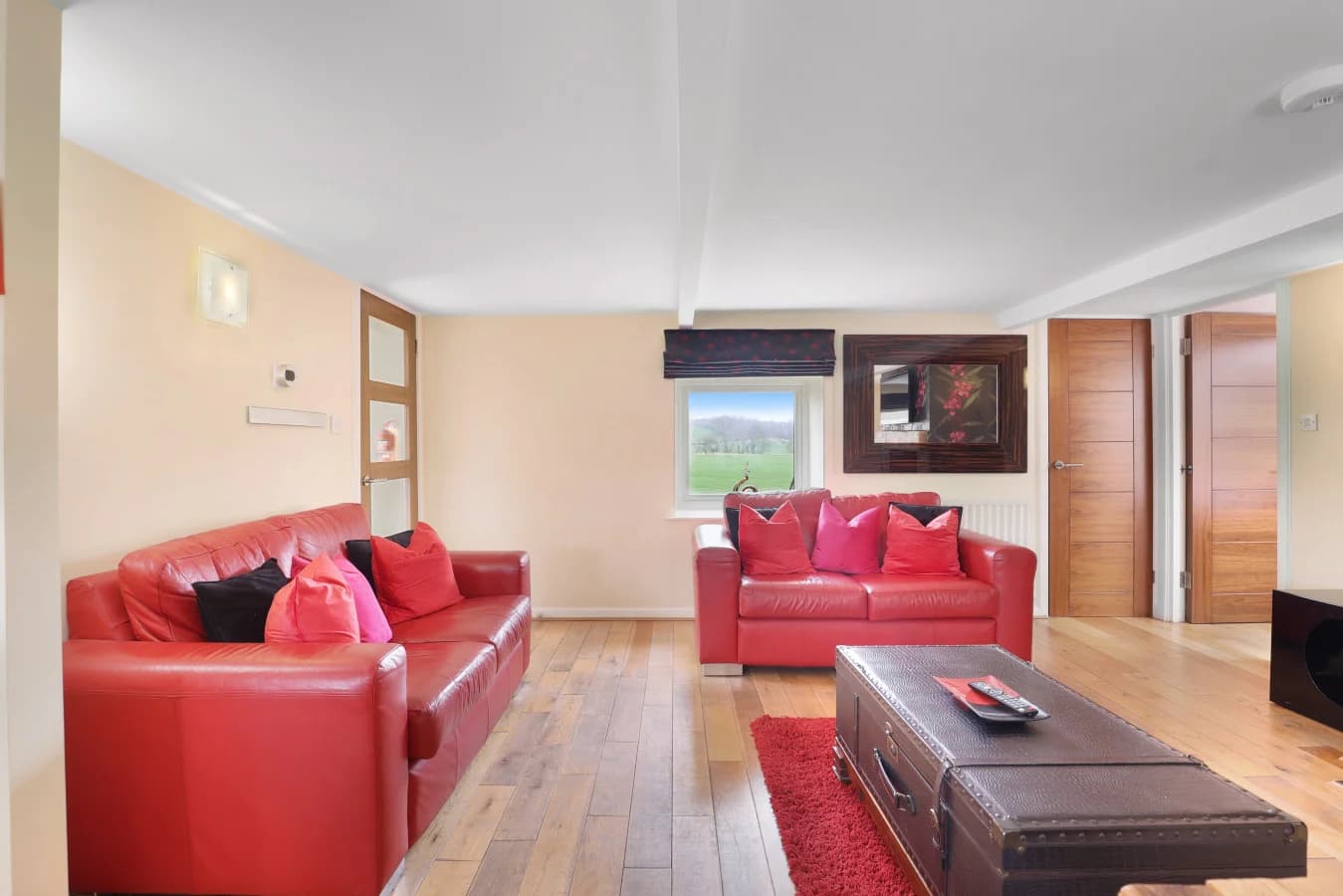 Lounge with leather sofas and countryside view