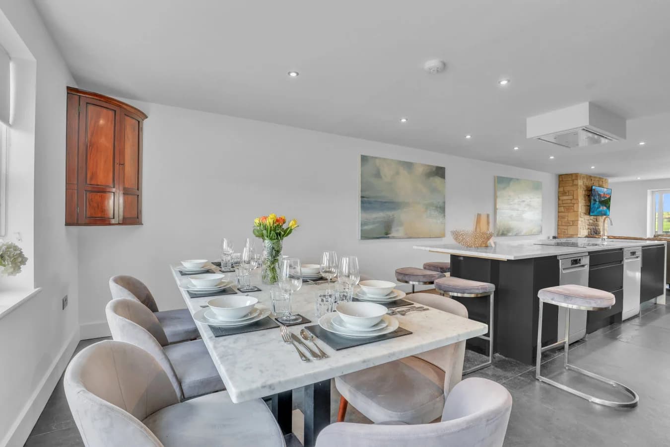 Marble dining table beside the luxury kitchen island