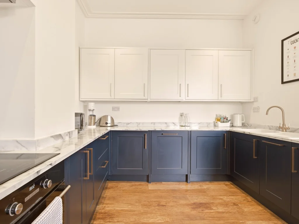 Fully equipped kitchen with generous worktop space and storage.