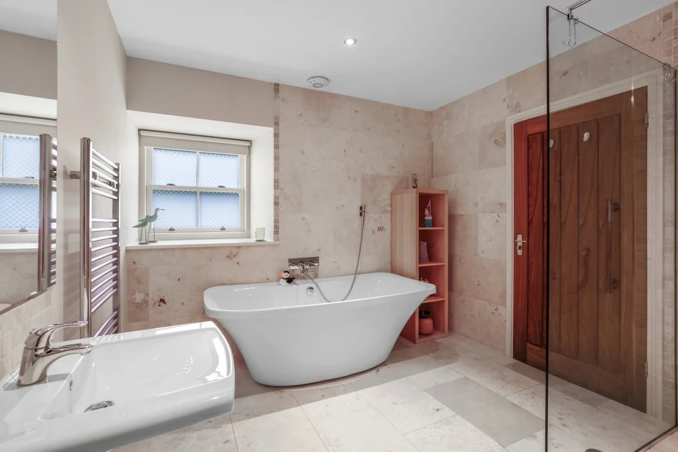 Luxury en-suite bathroom with freestanding bath and walk-in shower