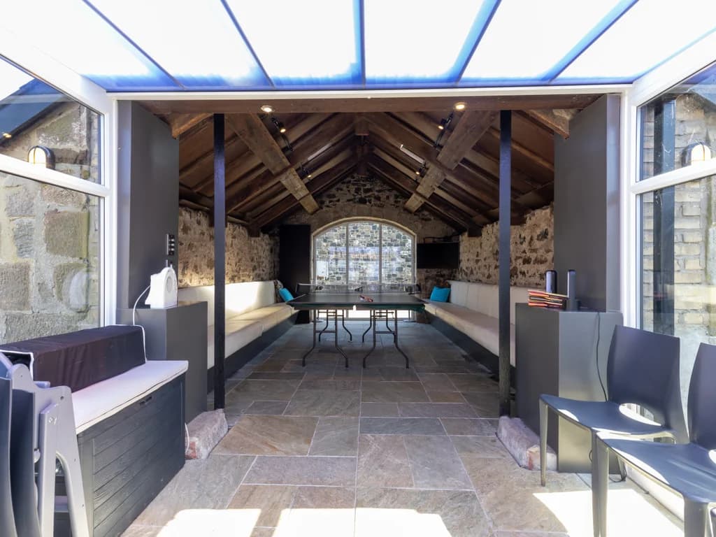 Gathering Place entrance with exposed stone and timber structure