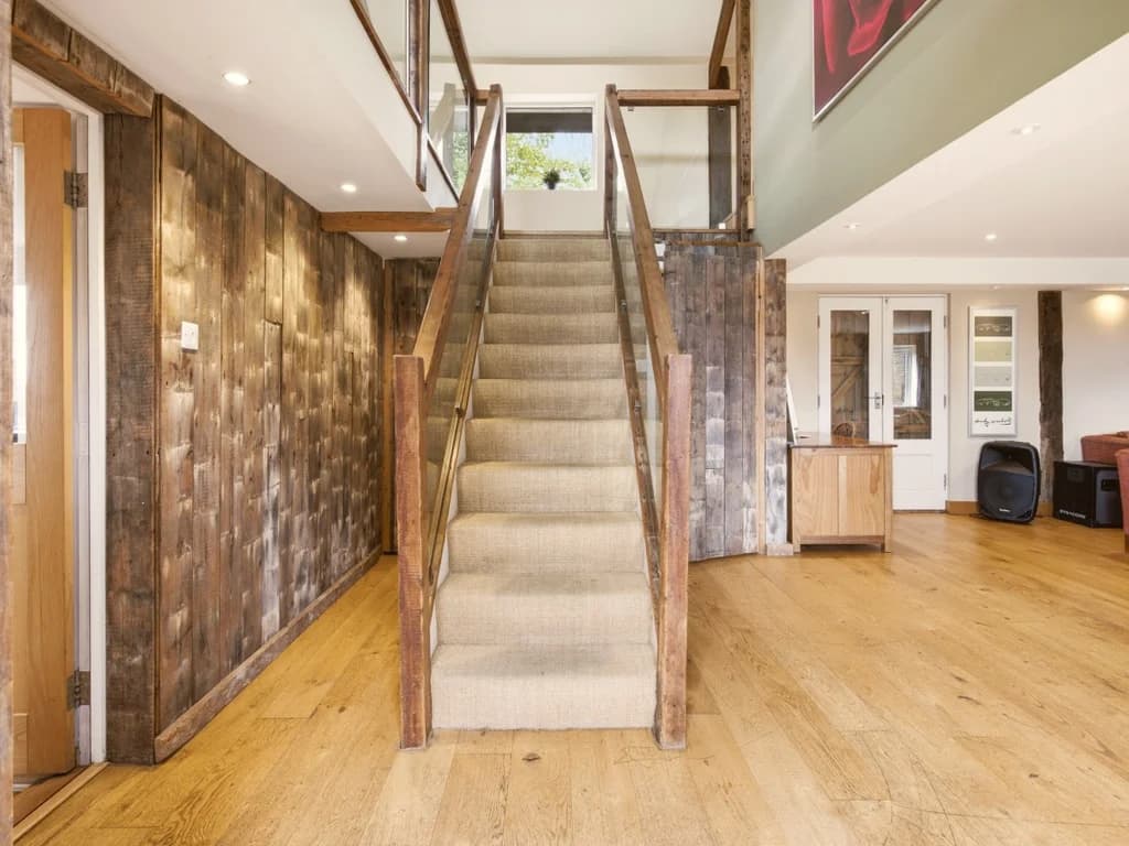 Timber staircase leading from the open-plan ground floor