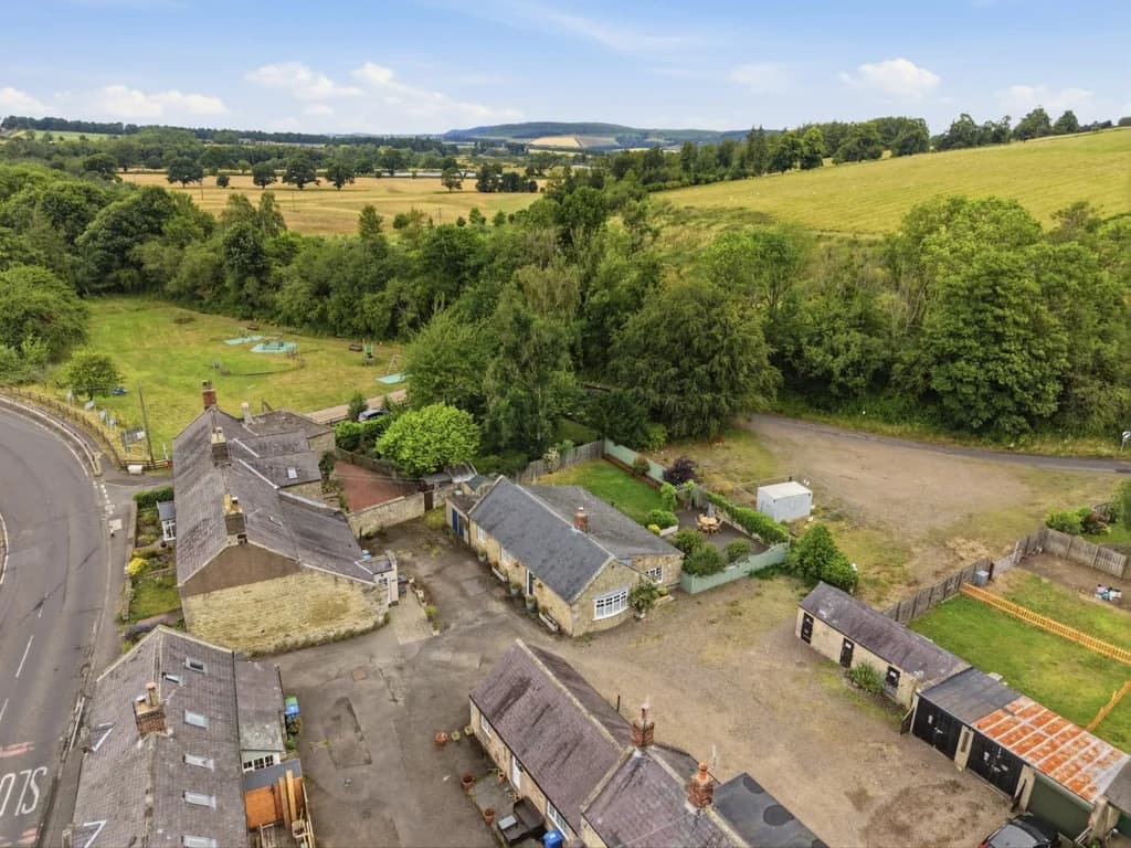 Aerial view of The Cottage surrounded by peaceful Northumberland countryside