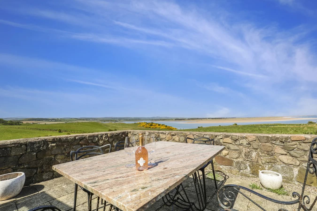 Patio dining area with panoramic bay views