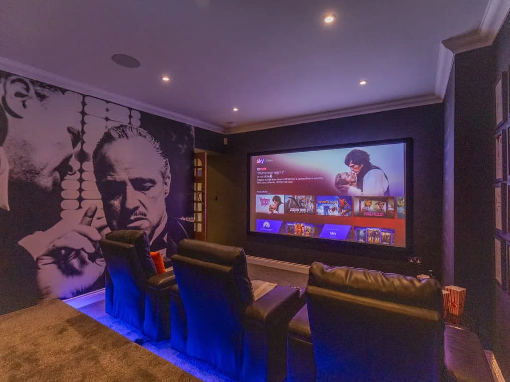Big-screen home cinema with Sky TV, surround sound and reclining seats.