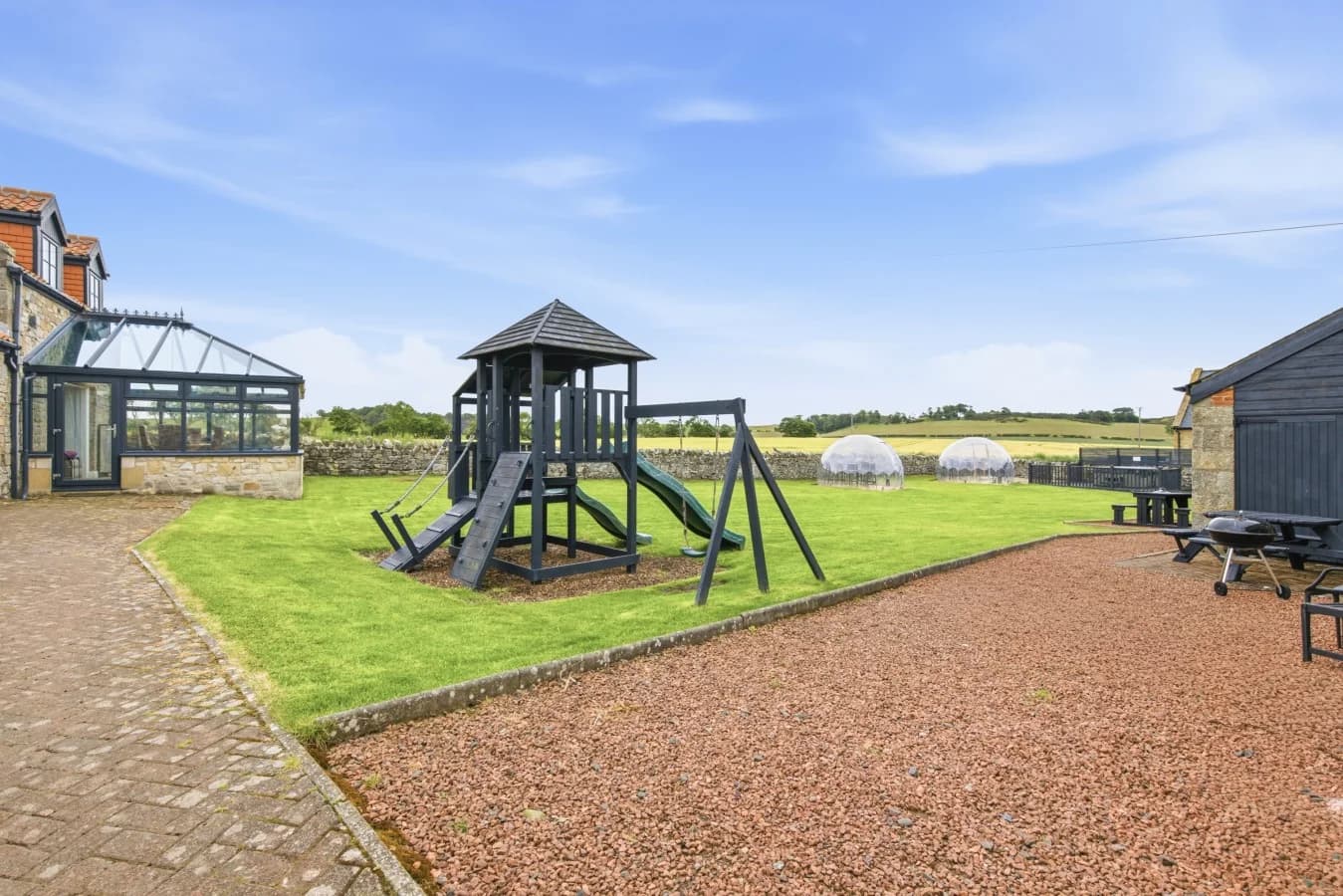 Children's play area beside the communal lawn