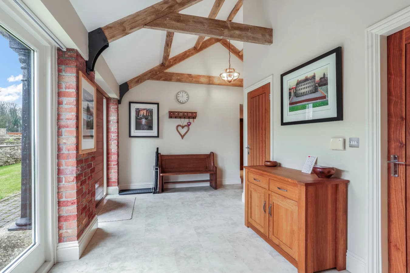 Entrance hallway with exposed brickwork and countryside views