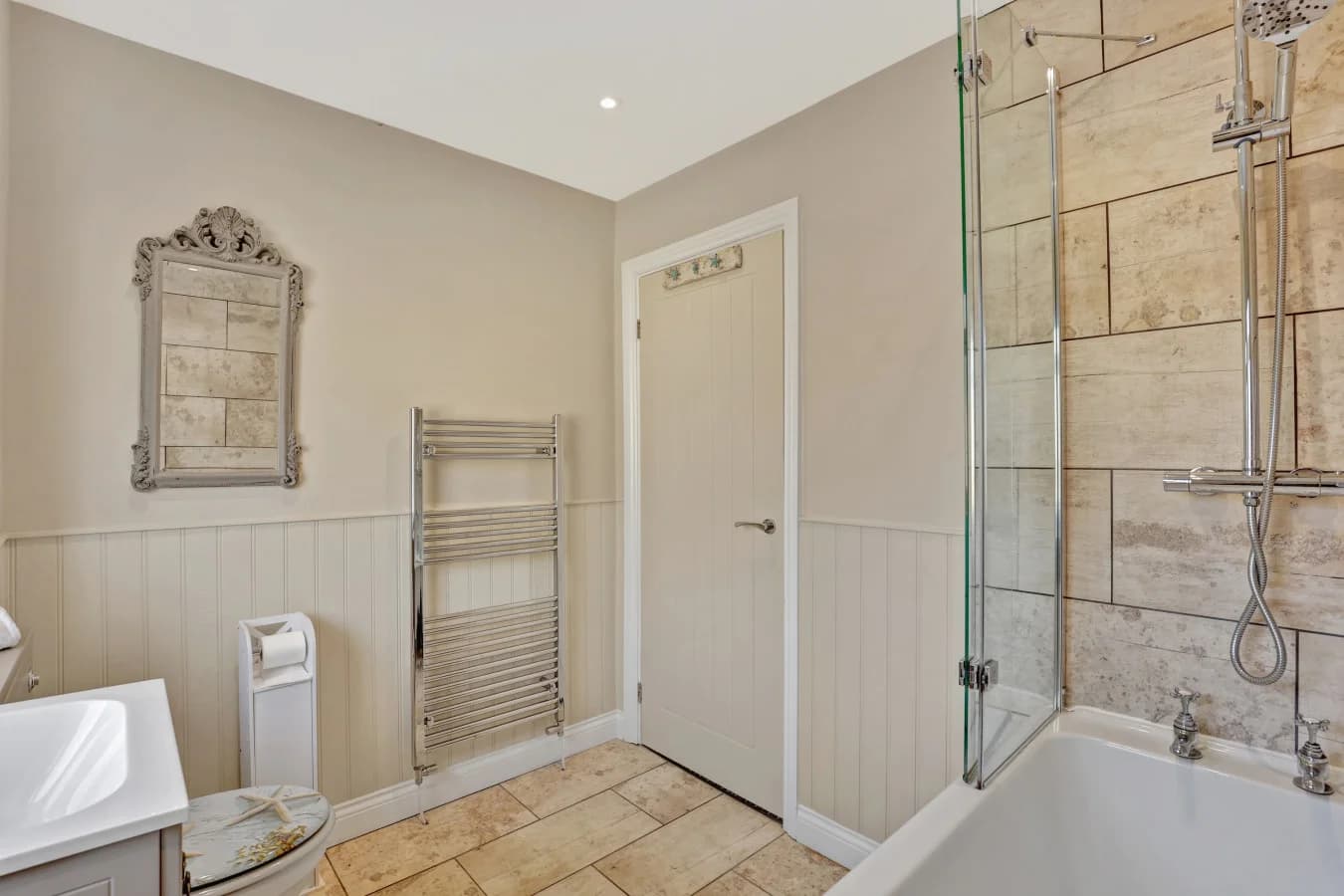 Family bathroom with shower-over-bath and heated towel rail