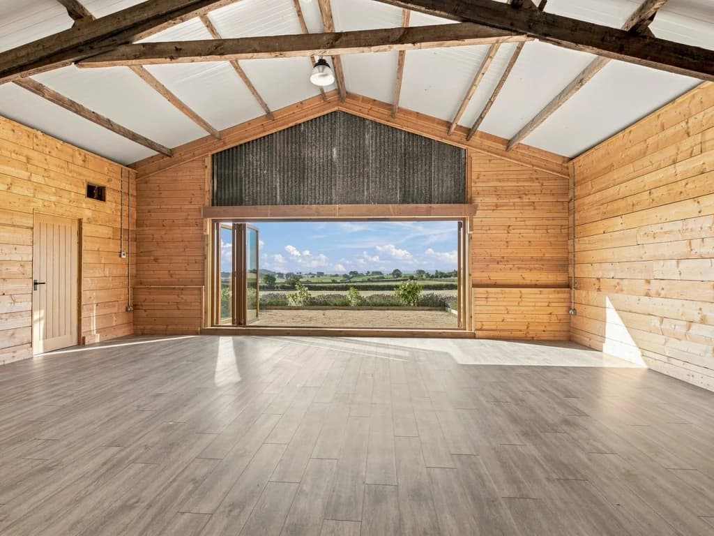 Event space opening directly onto far-reaching countryside views