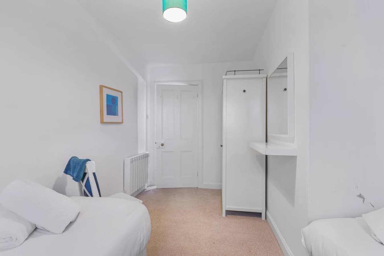 Twin bedroom with wardrobe, vanity shelf and bedside storage