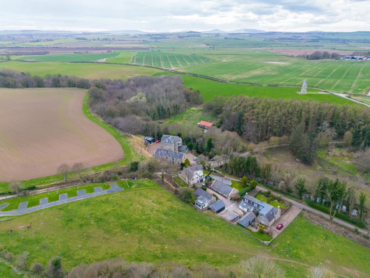 Aerial view of the cottage grounds and woodland setting