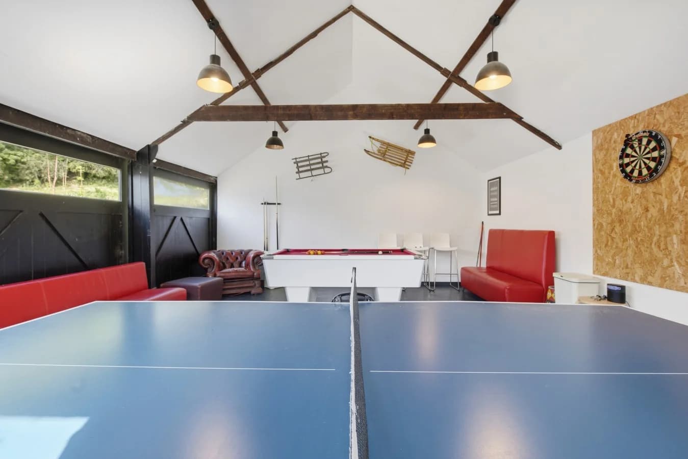 Spacious games room with pool table, table tennis and darts