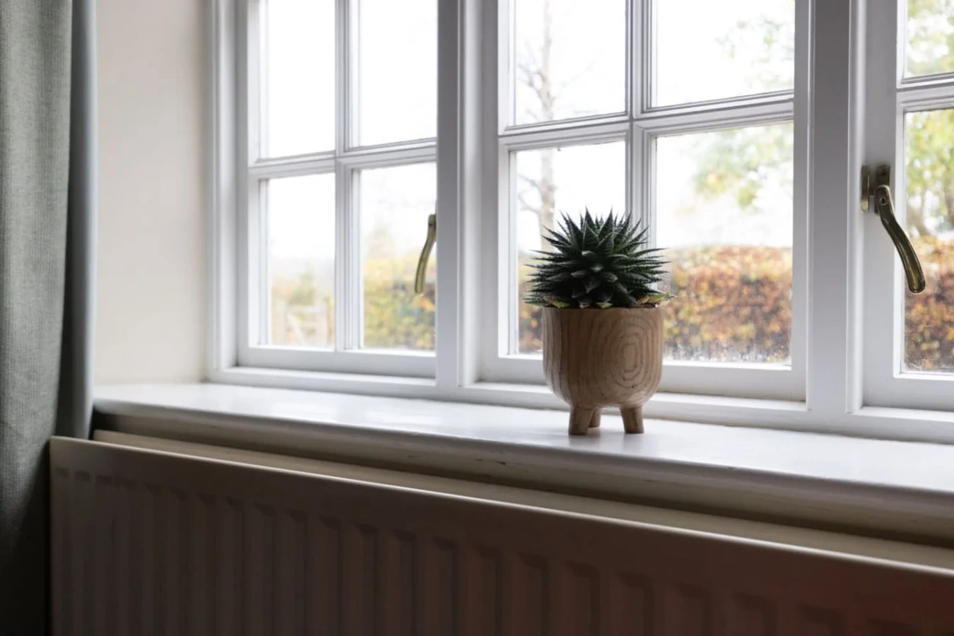 Deep cottage windows overlooking the grounds and countryside
