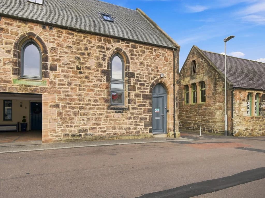 Stone-built exterior of Old Templars Hall with private entrance.
