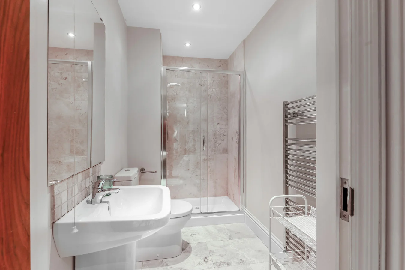 Contemporary bathroom with walk-in shower and heated towel rail