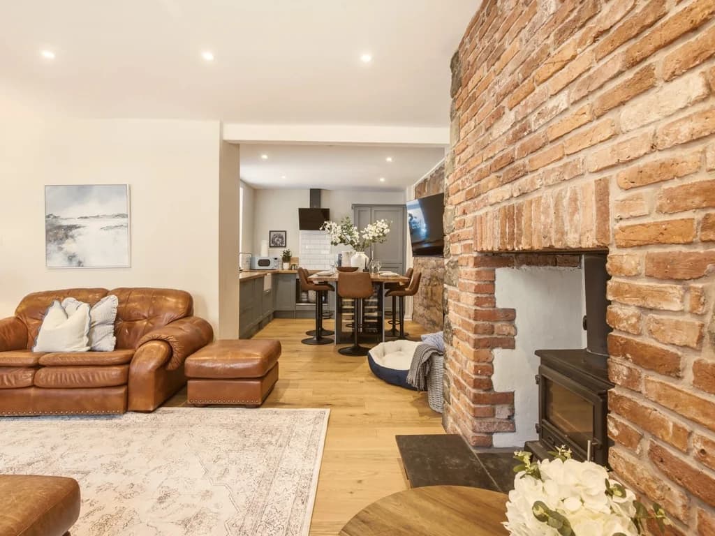 View from the fireplace towards the kitchen and dining area.