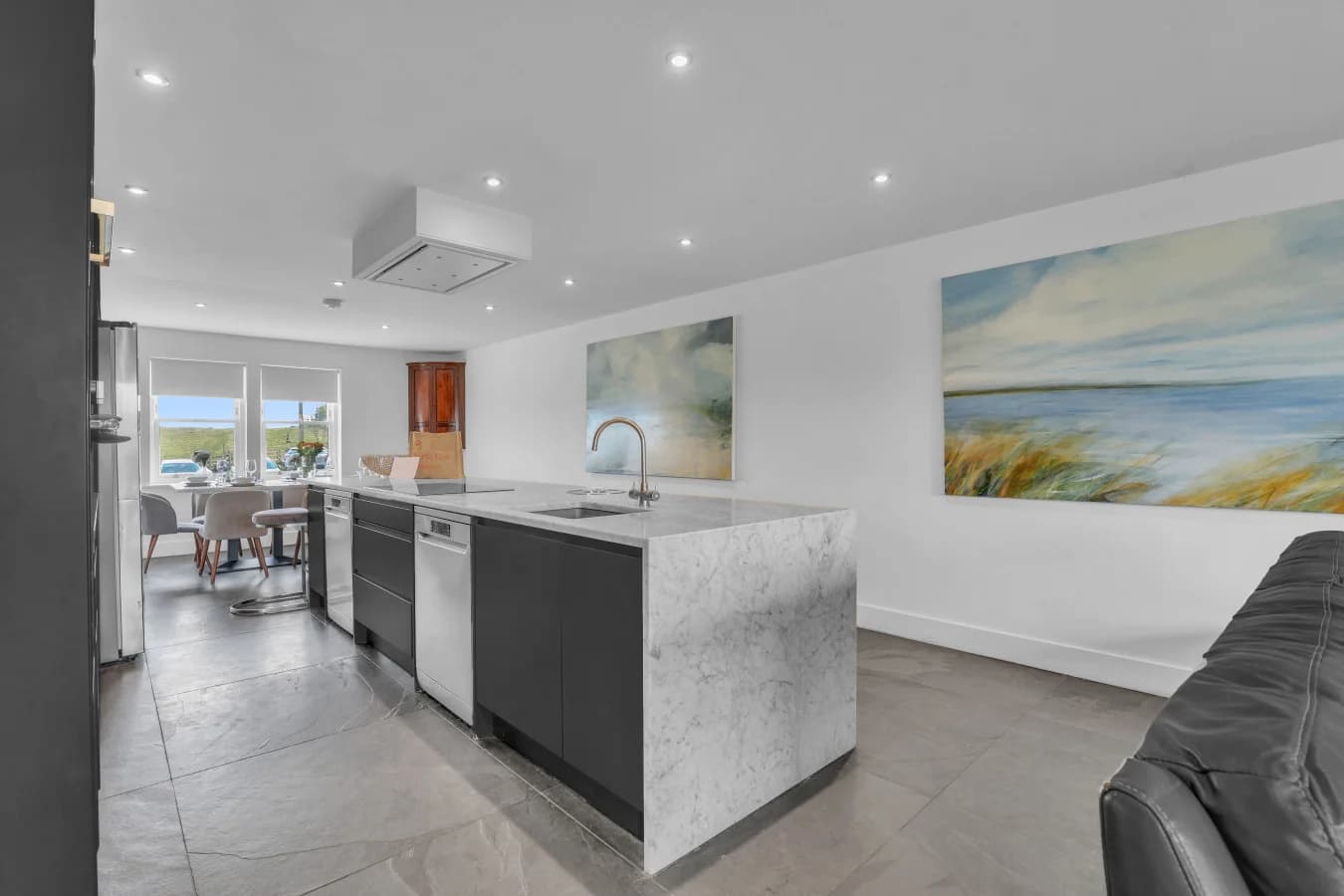 Sleek marble island with induction hob in the heart of the home