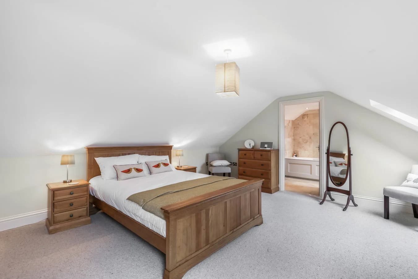 Spacious king bedroom with vaulted ceiling and en-suite access