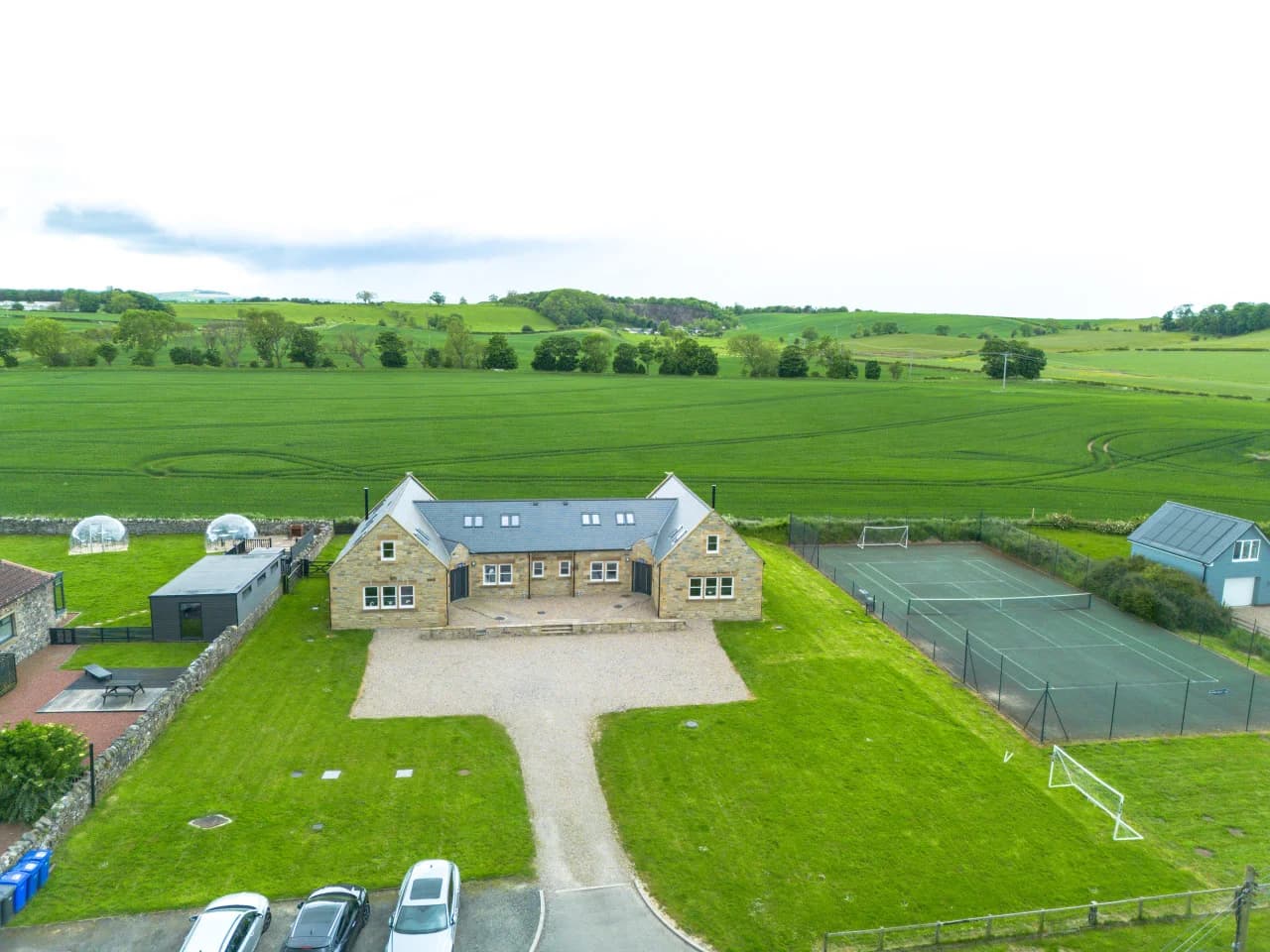 Aerial view of Dukesfield cottages and tennis court