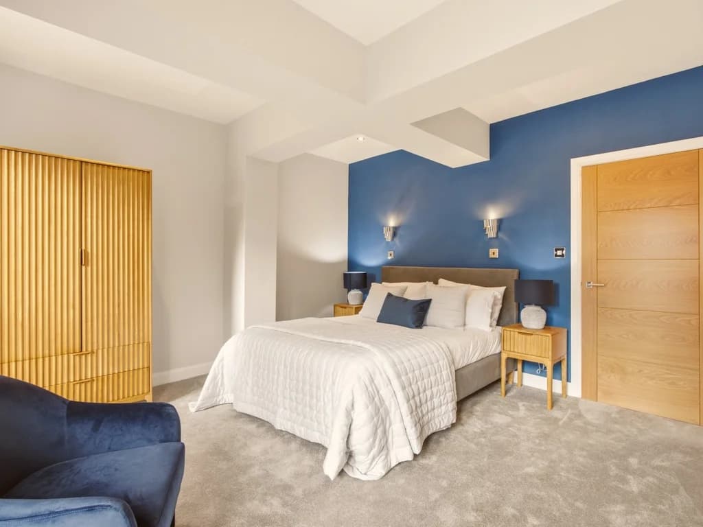 Spacious king bedroom with elegant décor and calming contemporary interiors