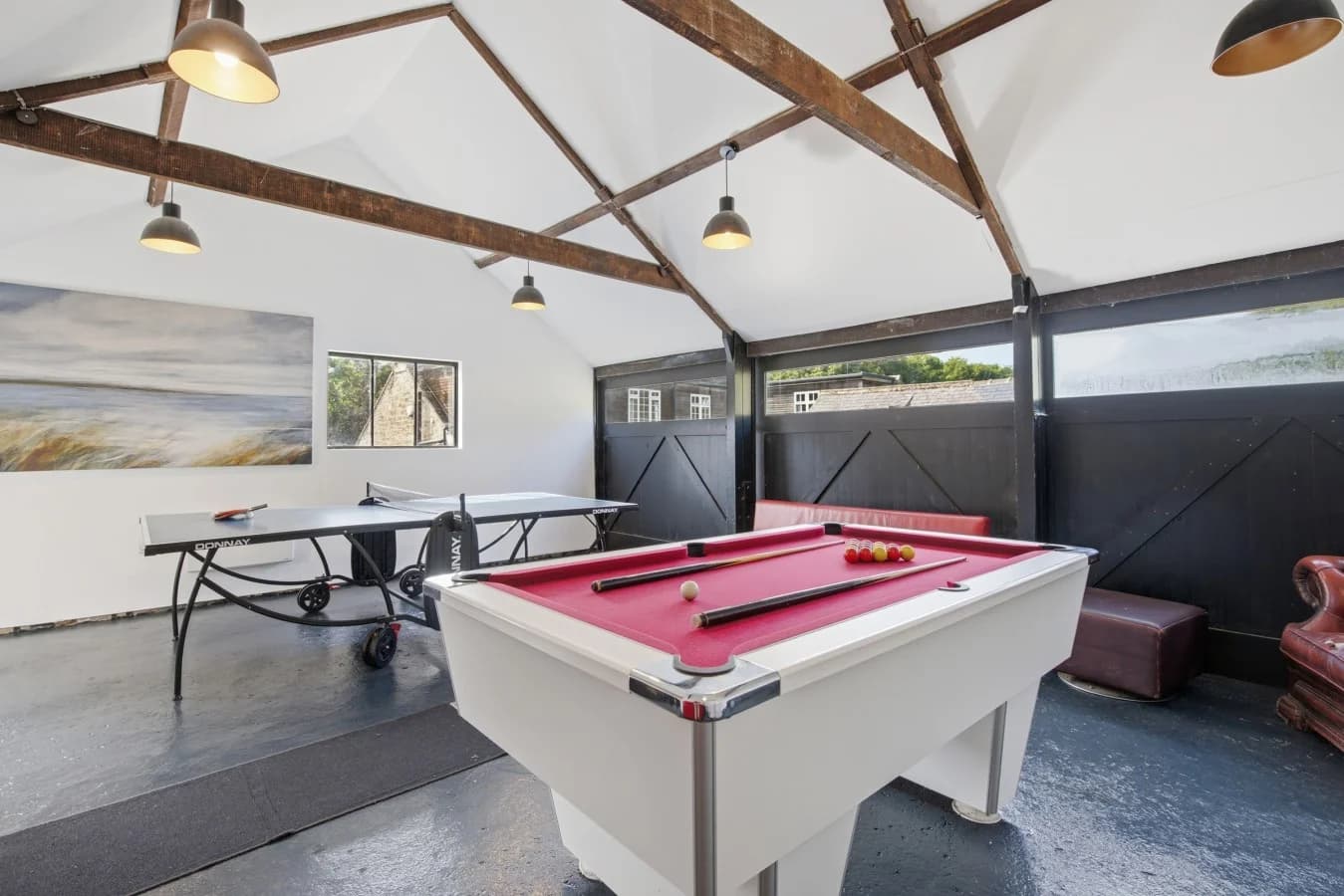 Games room with table tennis, pool table and comfy seating