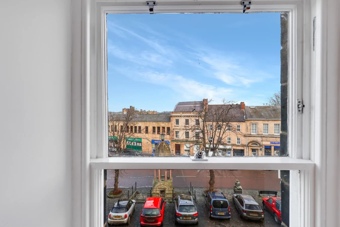 Framed views over Alnwick's historic streets and marketplace below