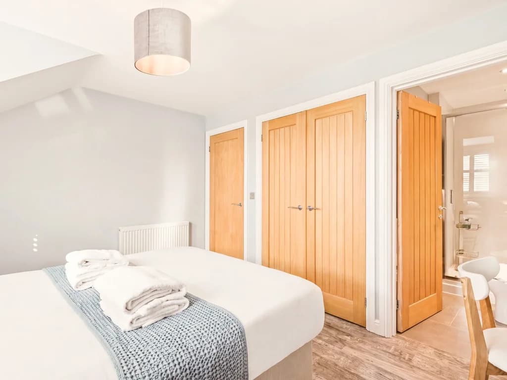 Bright king-size bedroom with built-in wardrobes and en-suite bathroom