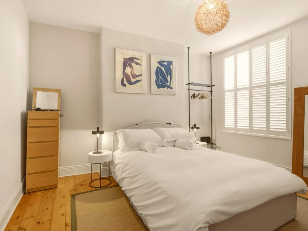 King-size bedroom with wardrobe, drawers, mirror and hanging space