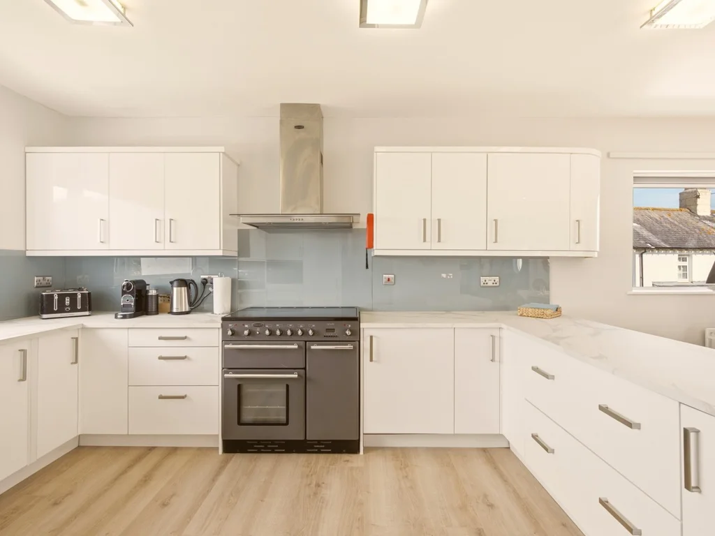 Modern fully equipped kitchen with generous workspace for effortless self-catering