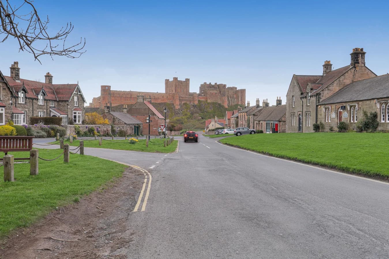 Views across Bamburgh village green towards the castle