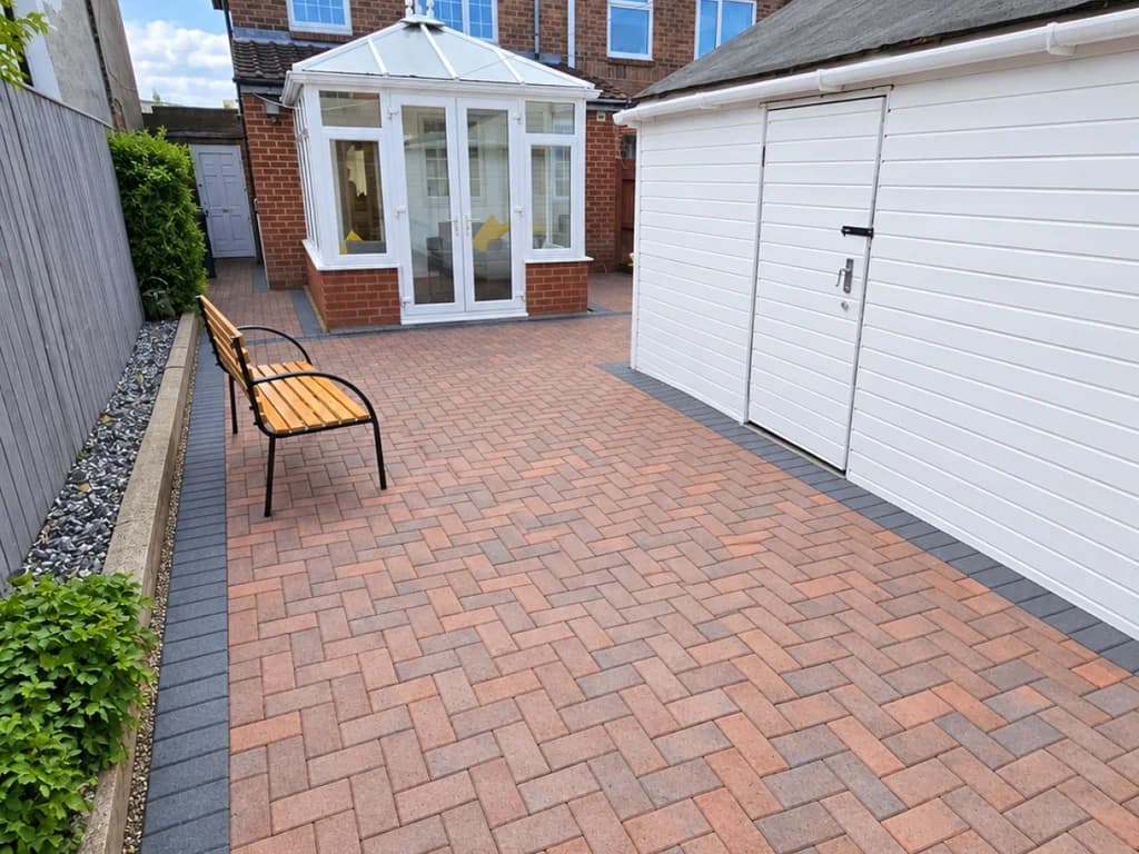 Enclosed rear patio with bench seating, storage shed and conservatory access