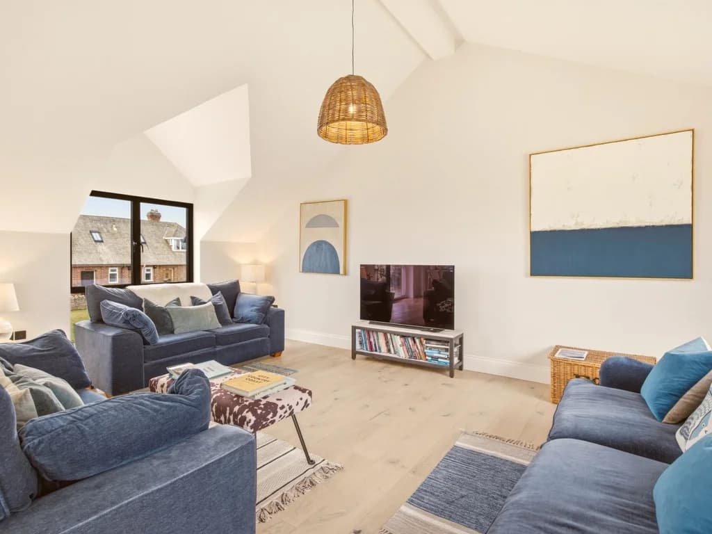 Contemporary living area with Smart TV and comfortable seating for eight