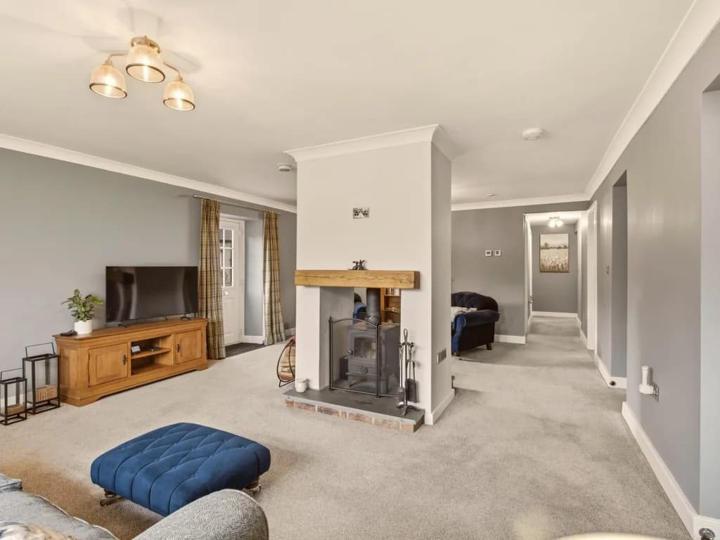 Comfortable living room with feature fireplace and Smart TV for cosy evenings