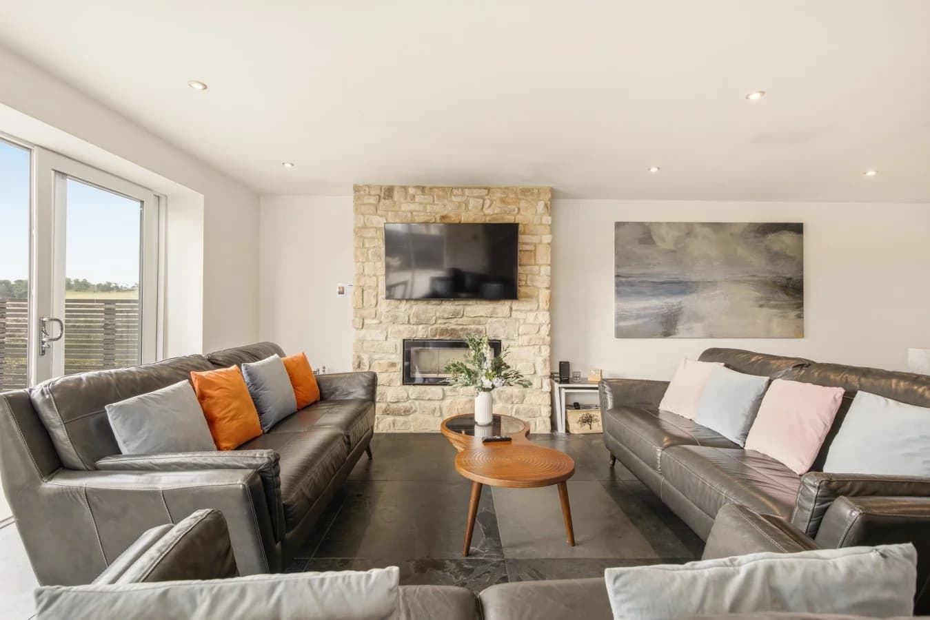 Lounge with leather seating and countryside-facing windows