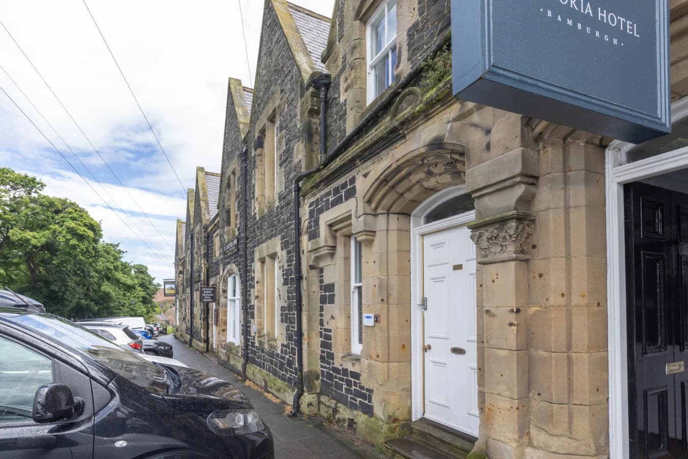 Stone-fronted cottage beside the Victoria Hotel