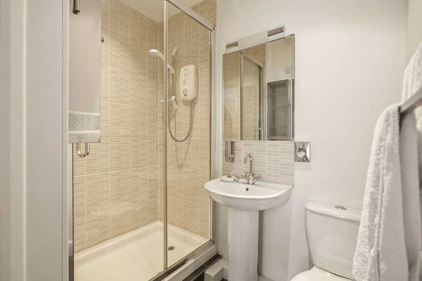En-suite shower room with walk-in shower and washbasin