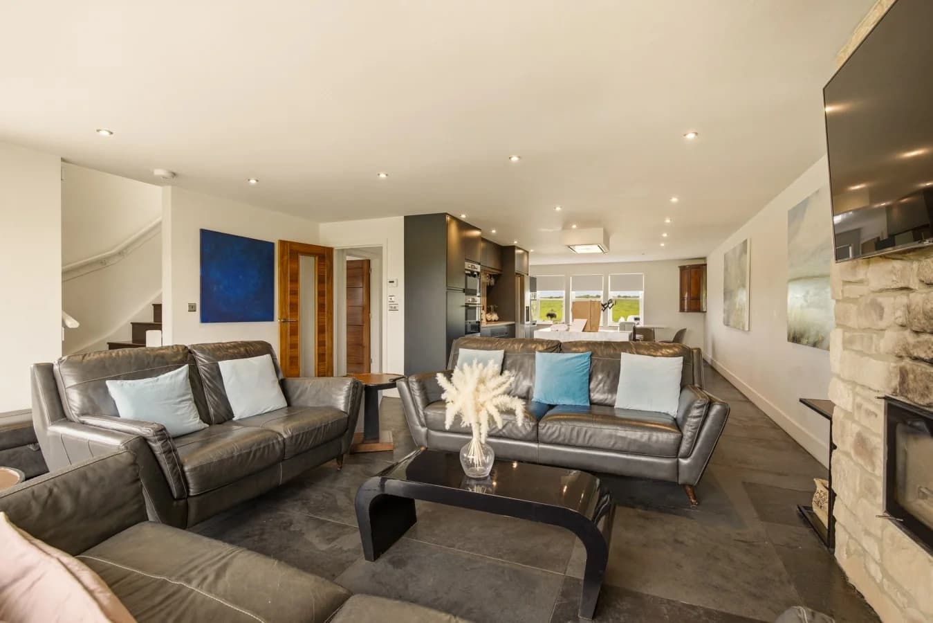 Spacious lounge with comfortable seating and open-plan design