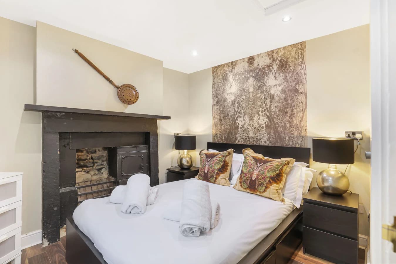 Ground-floor double bedroom with feature fireplace and deluxe finish