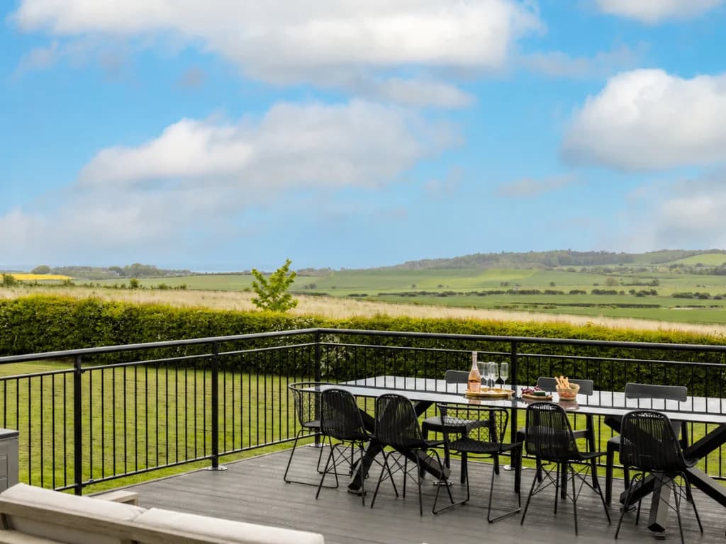 Outdoor dining on the deck with rolling country views.