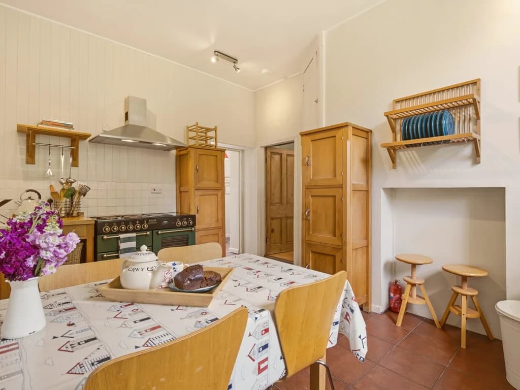 Traditional country kitchen with dining table and charming breakfast nook