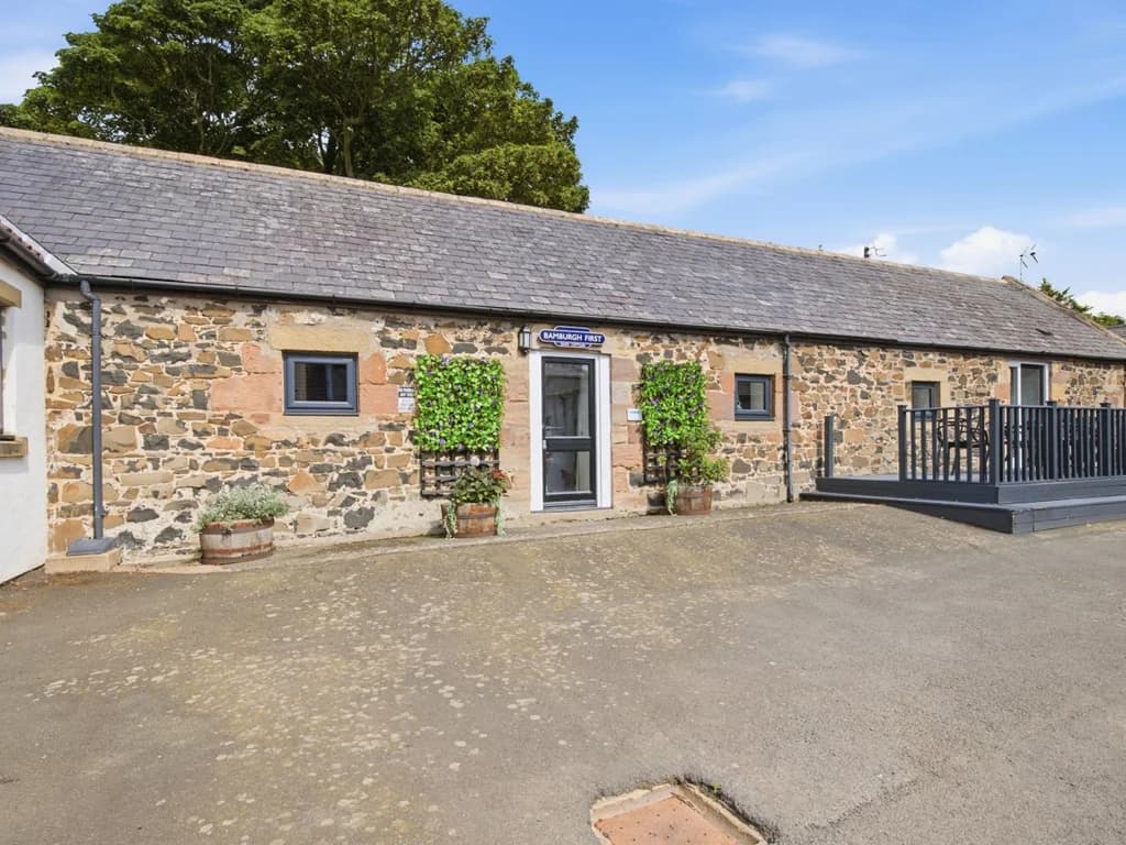 Stone cottage exterior with private decked entrance