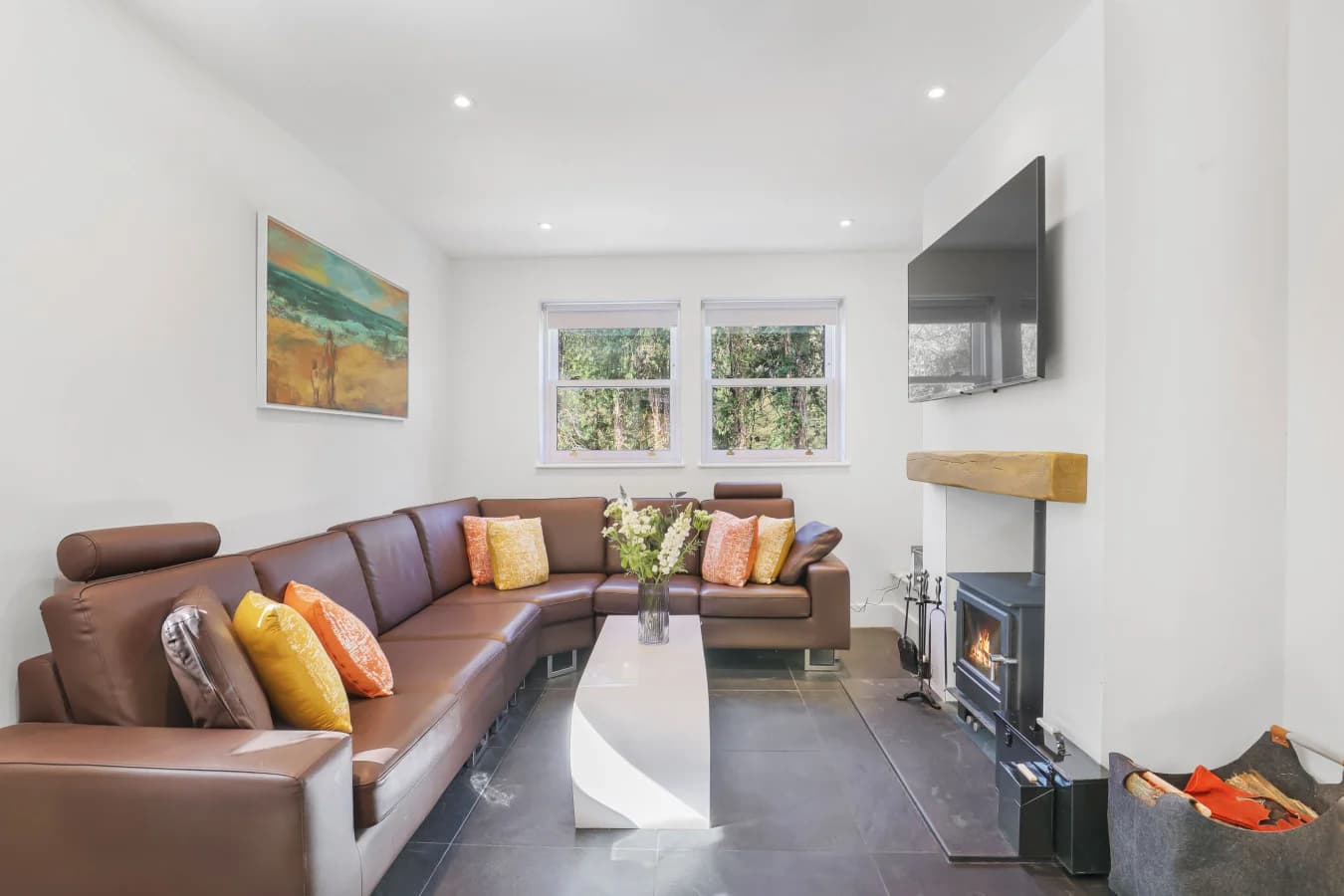Living area with log burner and corner sofa