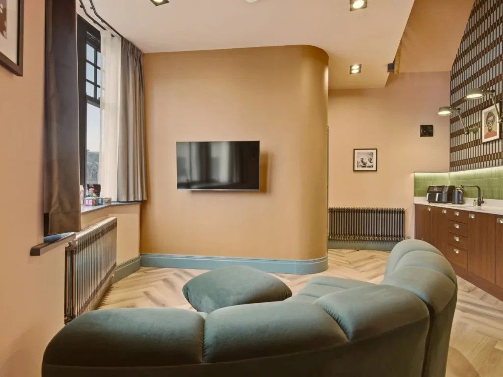 Bright living space with large window, Smart TV and kitchen counter