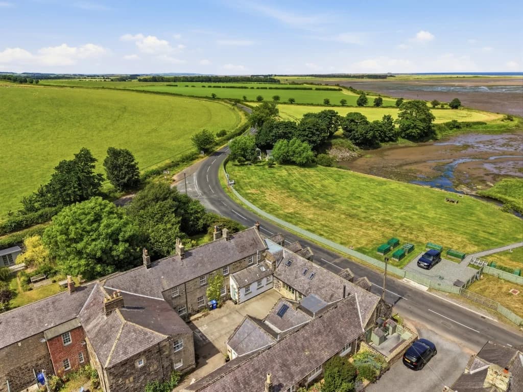 Aerial view of Waren Mill overlooking Budle Bay and the Northumberland coast