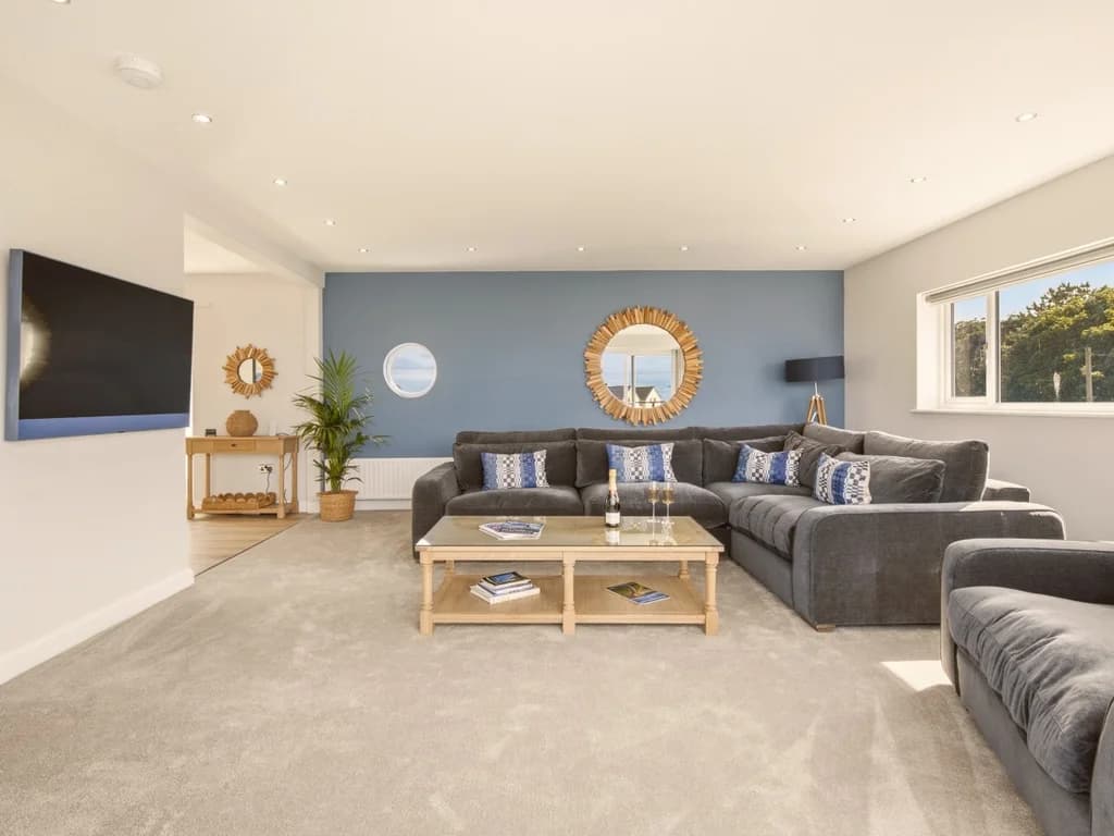 Spacious family lounge with Smart TV and comfortable seating for everyone