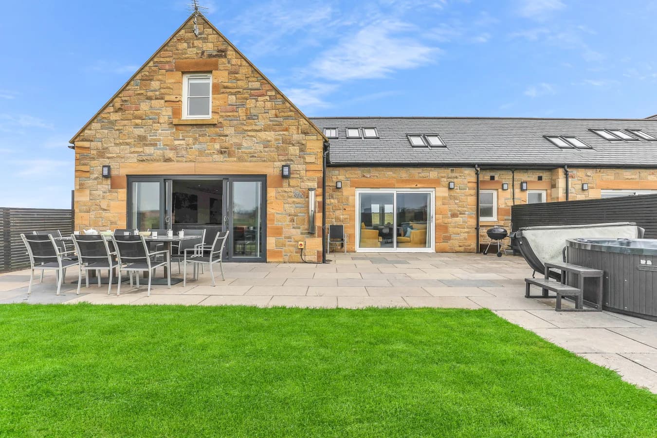 Stone-built cottage with private lawn, patio and hot tub