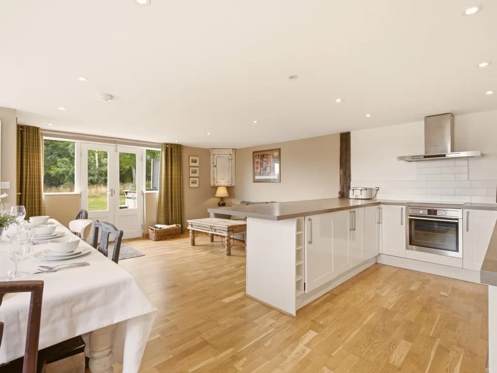Spacious kitchen and dining area with island and garden access