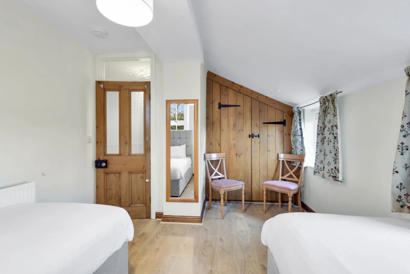 Thoughtfully designed twin room with built-in storage and seating